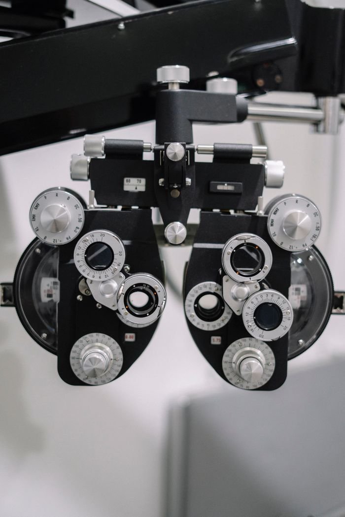 Detailed view of an optometry phoropter device for eye exams in a clinical setting.